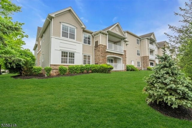 1111 Conrad Way, Franklin Twp, NJ 08873 - view of front of home featuring a front yard and stone siding