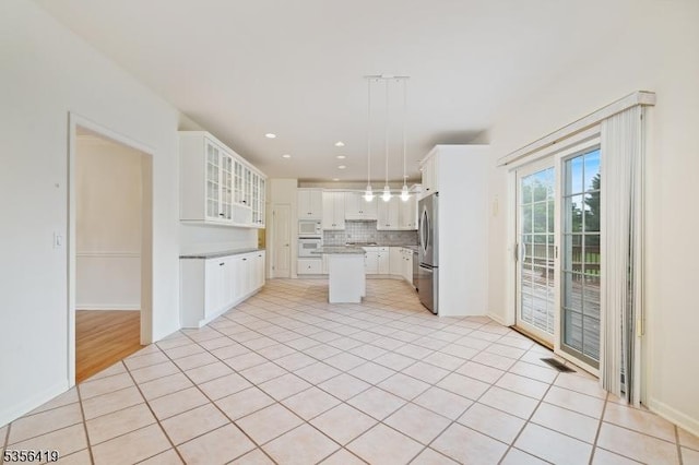 1 Joss Way, Long Hill Twp, NJ 07946 - kitchen with white appliances, a center island, backsplash, white cabinets, and glass insert cabinets
