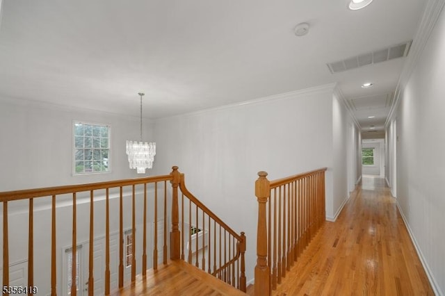 1 Joss Way, Long Hill Twp, NJ 07946 - corridor with an upstairs landing, plenty of natural light, wood finished floors, a chandelier, and crown molding