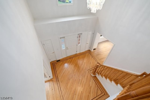 1 Joss Way, Long Hill Twp, NJ 07946 - foyer entrance featuring wood finished floors, a chandelier, stairs, and a high ceiling