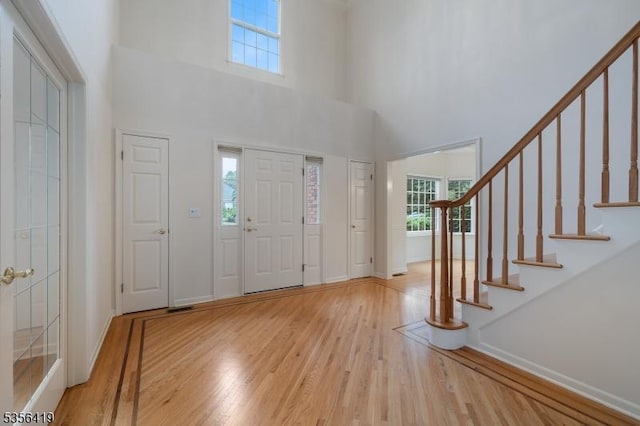1 Joss Way, Long Hill Twp, NJ 07946 - foyer entrance with plenty of natural light, wood finished floors, a towering ceiling, and stairs
