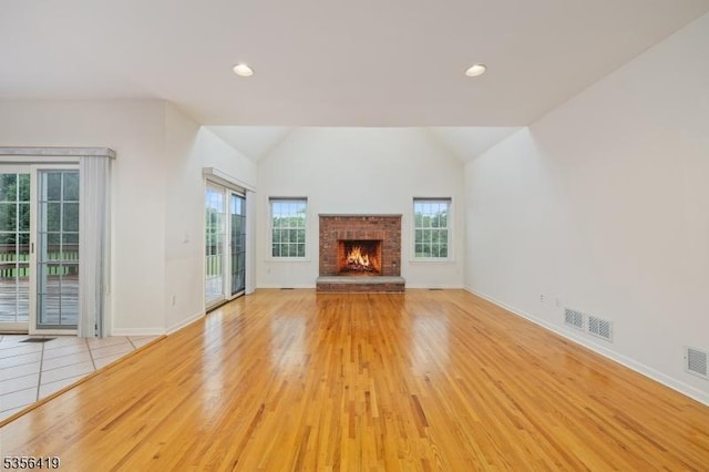 1 Joss Way, Long Hill Twp, NJ 07946 - unfurnished living room featuring a fireplace, vaulted ceiling, wood finished floors, and recessed lighting