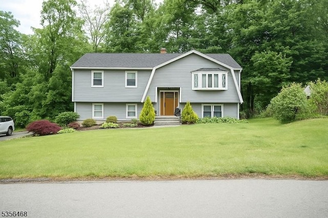 10 Lincoln Ave, Vernon Twp, NJ 07462 - raised ranch with a front lawn and a chimney
