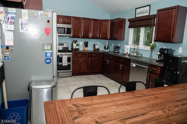 10 Lincoln Ave, Vernon Twp, NJ 07462 - kitchen with appliances with stainless steel finishes, a sink, vaulted ceiling, light tile patterned floors, and dark brown cabinets