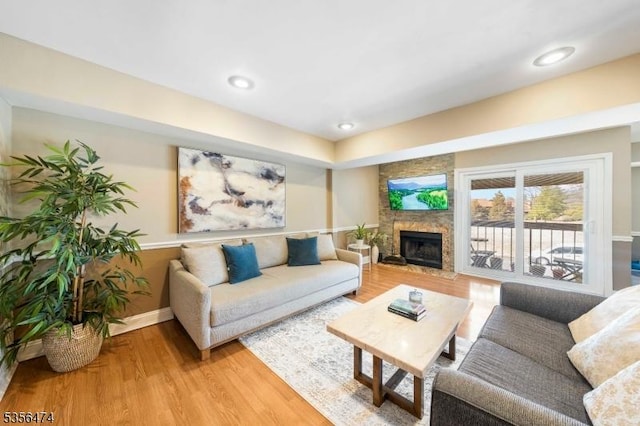 3522 Richmond Ct, Hillsborough Twp, NJ 08844 - living area featuring light wood-type flooring, a large fireplace, and baseboards