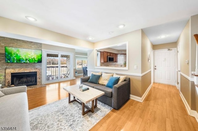 3522 Richmond Ct, Hillsborough Twp, NJ 08844 - living room featuring light wood finished floors, baseboards, and a premium fireplace