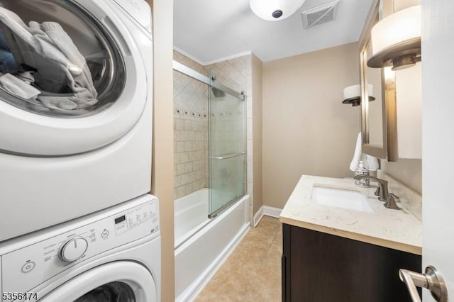 3522 Richmond Ct, Hillsborough Twp, NJ 08844 - bathroom with stacked washer and clothes dryer, tile patterned floors, vanity, and combined bath / shower with glass door