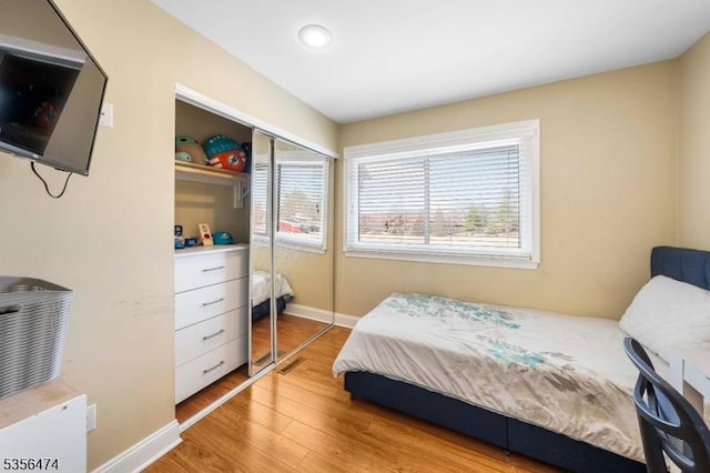 3522 Richmond Ct, Hillsborough Twp, NJ 08844 - bedroom featuring light wood finished floors, baseboards, and a closet