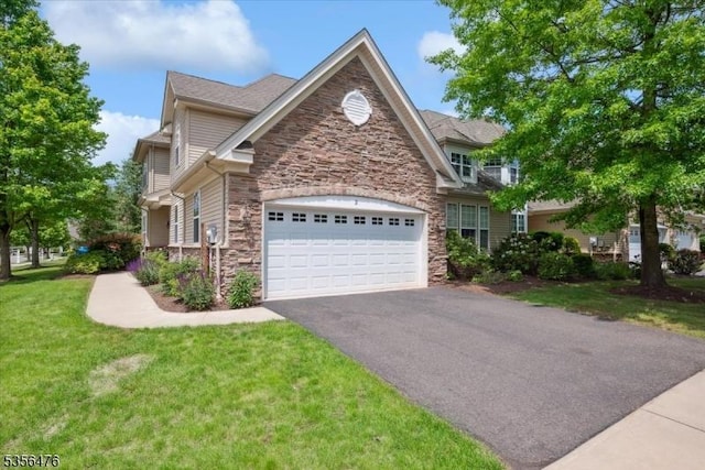 2 Fehervari Ct, Franklin Twp, NJ 08873 - view of front of property featuring stone siding, driveway, an attached garage, and a front lawn