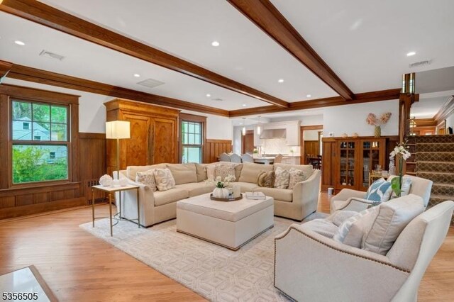 34 Crane Rd, Mountain Lakes Boro, NJ 07046 - living room with beam ceiling, light wood finished floors, a wainscoted wall, ornamental molding, and recessed lighting