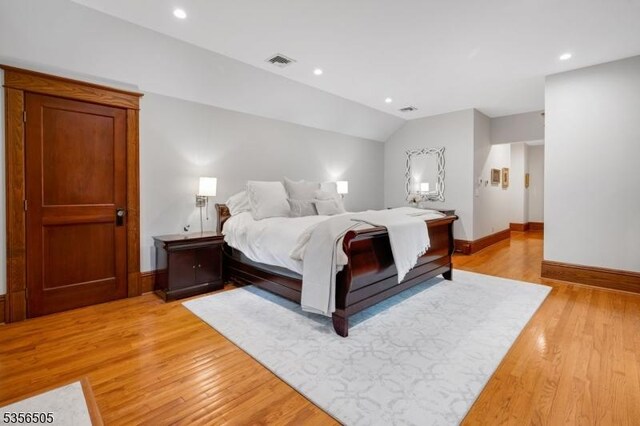 34 Crane Rd, Mountain Lakes Boro, NJ 07046 - bedroom with light wood-style floors, baseboards, recessed lighting, and lofted ceiling