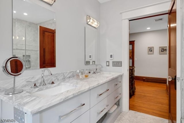 34 Crane Rd, Mountain Lakes Boro, NJ 07046 - full bathroom featuring double vanity, a shower stall, recessed lighting, baseboards, and wood finished floors
