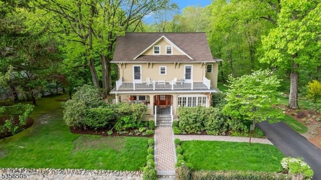 34 Crane Rd, Mountain Lakes Boro, NJ 07046 - view of front of house with a porch, stucco siding, a front yard, and stairs