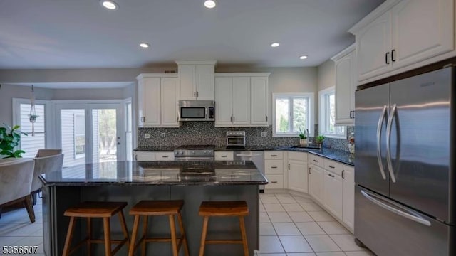 1 Dewing Ct, Raritan Twp, NJ 08551 - kitchen featuring appliances with stainless steel finishes, a sink, tasteful backsplash, white cabinetry, and recessed lighting