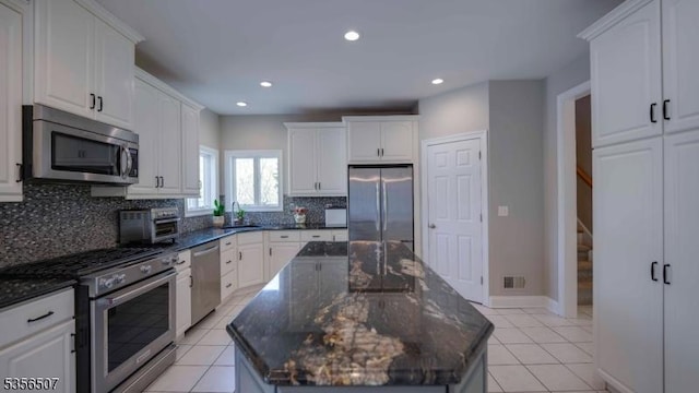 1 Dewing Ct, Raritan Twp, NJ 08551 - kitchen with stainless steel appliances, tasteful backsplash, a center island, white cabinets, and recessed lighting