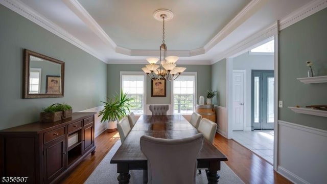 1 Dewing Ct, Raritan Twp, NJ 08551 - dining area featuring a chandelier, dark wood finished floors, a tray ceiling, and ornamental molding