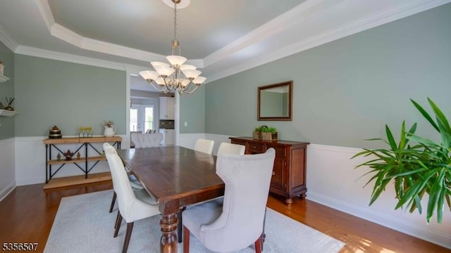 1 Dewing Ct, Raritan Twp, NJ 08551 - dining area featuring a chandelier, wood finished floors, a tray ceiling, ornamental molding, and baseboards