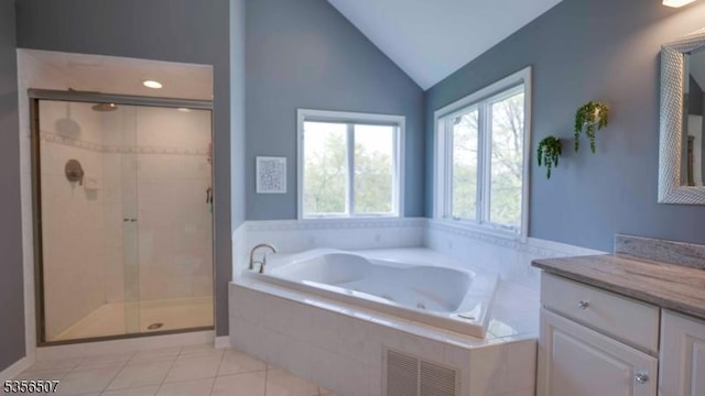1 Dewing Ct, Raritan Twp, NJ 08551 - bathroom featuring a stall shower, a garden tub, tile patterned floors, vanity, and vaulted ceiling