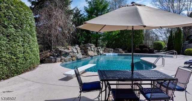 1 Dewing Ct, Raritan Twp, NJ 08551 - swimming pool featuring a patio, a diving board, and outdoor dining space