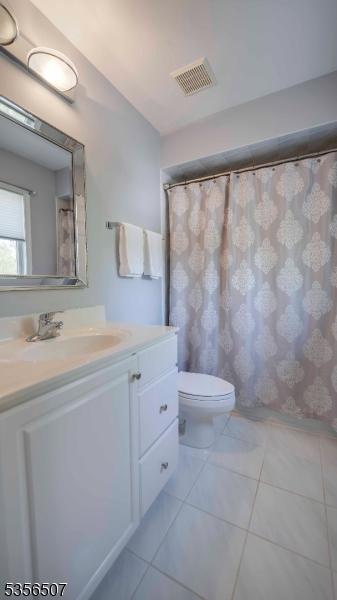 1 Dewing Ct, Raritan Twp, NJ 08551 - full bathroom featuring vanity, toilet, and tile patterned floors