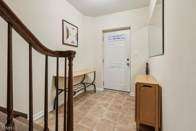 foyer entrance with baseboards