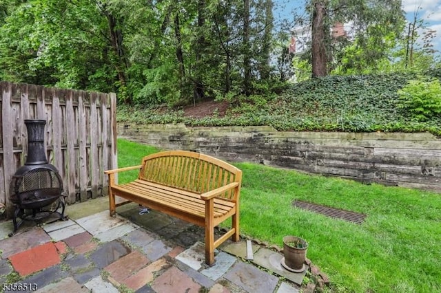 view of property's community with a patio area