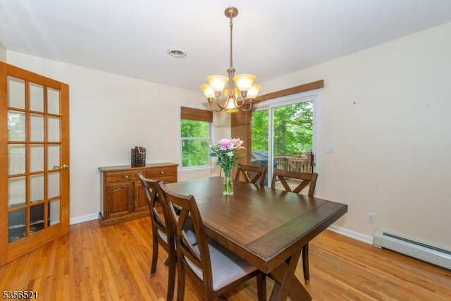 19 Esther Dr, Vernon Twp, NJ 07422 - dining room with a baseboard heating unit, a chandelier, light wood finished floors, and baseboards