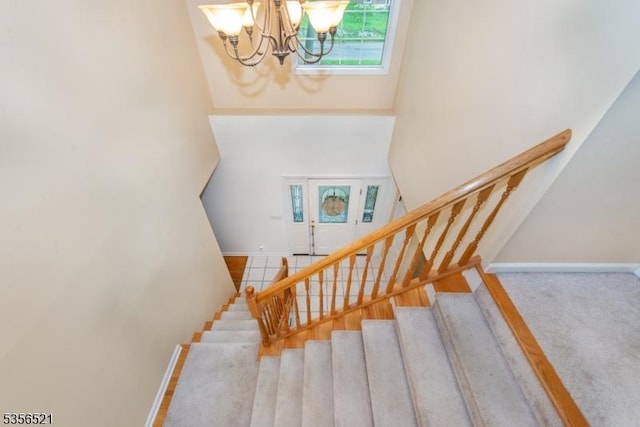 19 Esther Dr, Vernon Twp, NJ 07422 - stairs with a towering ceiling, a chandelier, and baseboards