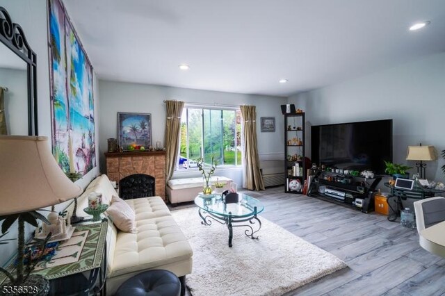 living room featuring wood finished floors and recessed lighting