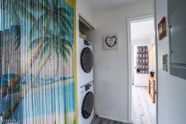 laundry area with stacked washer / drying machine