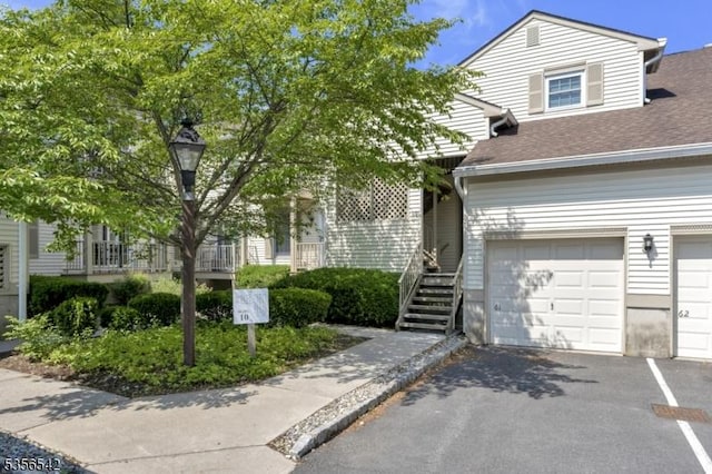 66 Jamestown Rd, Bernards Twp, NJ 07920 - view of front of property with driveway, a garage, and roof with shingles