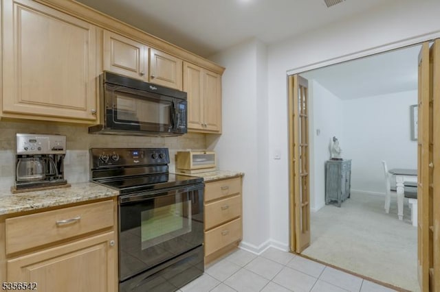 66 Jamestown Rd, Bernards Twp, NJ 07920 - kitchen with black appliances, light brown cabinets, light tile patterned floors, light stone counters, and baseboards