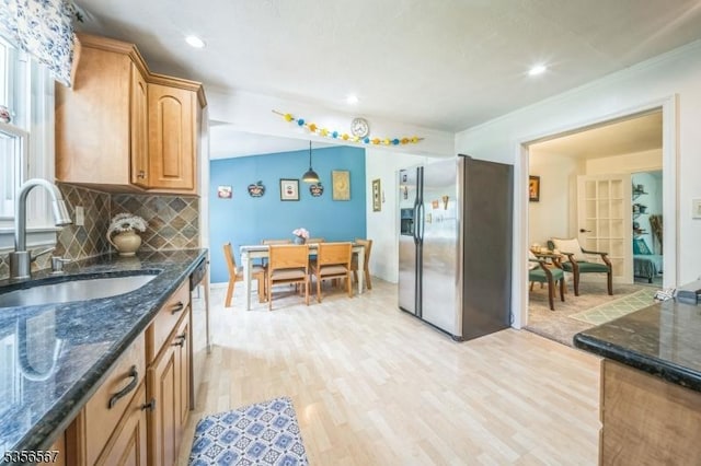 129 River Dr, Parsippany-Troy Hills Twp, NJ 07034 - kitchen with appliances with stainless steel finishes, a sink, light wood-style flooring, tasteful backsplash, and dark stone countertops