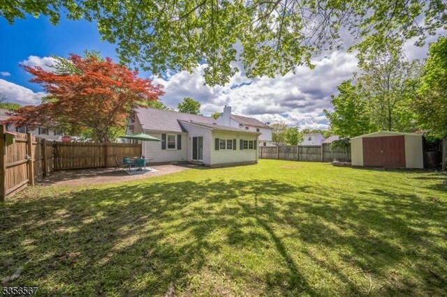 129 River Dr, Parsippany-Troy Hills Twp, NJ 07034 - view of yard featuring a shed, a patio area, and an outdoor structure