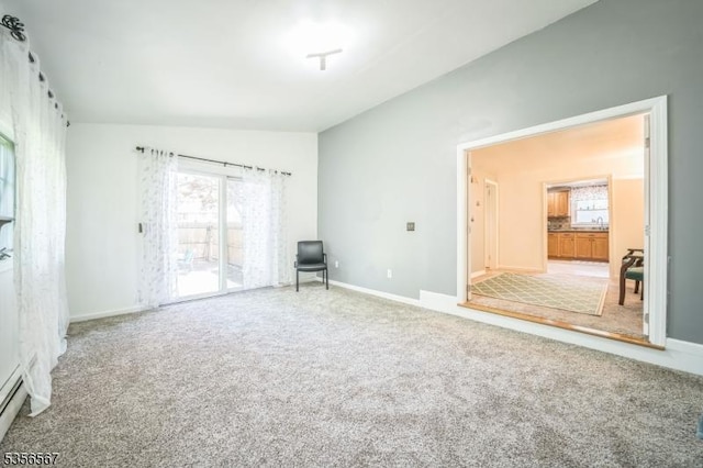 129 River Dr, Parsippany-Troy Hills Twp, NJ 07034 - empty room with plenty of natural light, vaulted ceiling, carpet, and baseboards