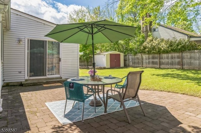 129 River Dr, Parsippany-Troy Hills Twp, NJ 07034 - view of patio featuring a storage unit, an outdoor structure, and outdoor dining space