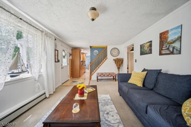 129 River Dr, Parsippany-Troy Hills Twp, NJ 07034 - living room featuring a baseboard radiator, light colored carpet, stairway, and a textured ceiling