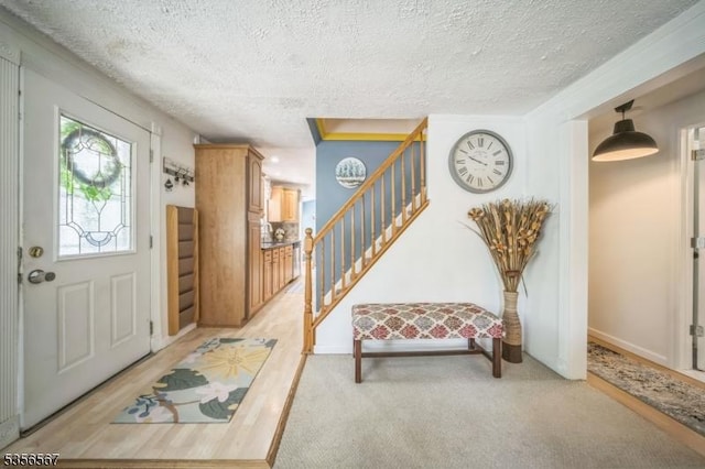 129 River Dr, Parsippany-Troy Hills Twp, NJ 07034 - entrance foyer with a textured ceiling, stairs, and light carpet