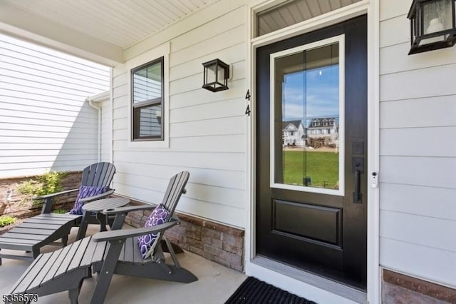 doorway to property featuring covered porch