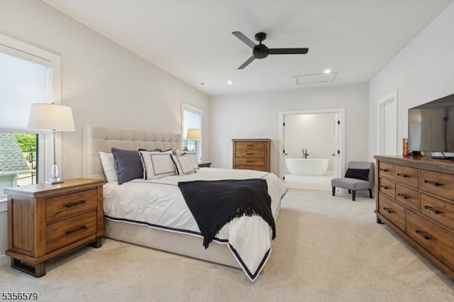 bedroom with attic access, light carpet, recessed lighting, ensuite bathroom, and ceiling fan