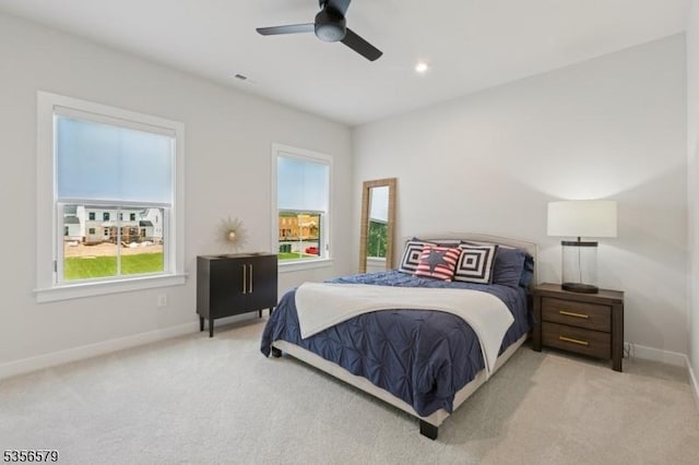 bedroom with carpet flooring, baseboards, and ceiling fan
