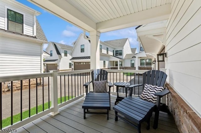 wooden terrace with a residential view