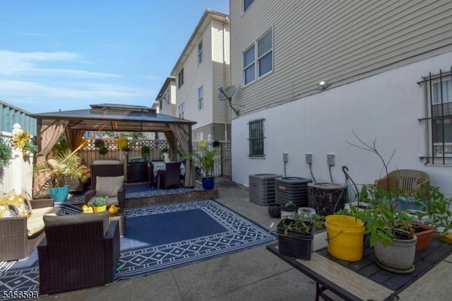 127 Brill St, Newark City, NJ 07105 - view of patio featuring a gazebo, a fenced backyard, an outdoor hangout area, and cooling unit