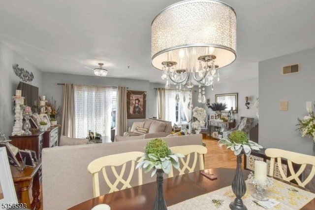 127 Brill St, Newark City, NJ 07105 - dining area with a chandelier and wood finished floors