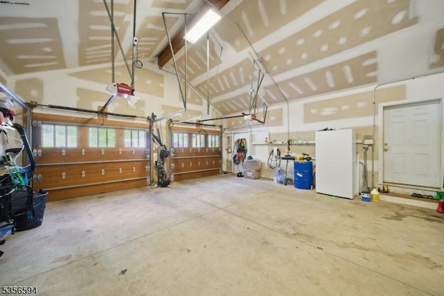 44 Mount Pleasant Rd, Knowlton Twp, NJ 07832 - garage featuring a garage door opener and freestanding refrigerator
