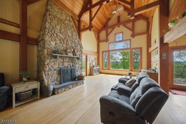 44 Mount Pleasant Rd, Knowlton Twp, NJ 07832 - living area with high vaulted ceiling, beam ceiling, wood finished floors, wood ceiling, and a stone fireplace