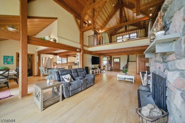 44 Mount Pleasant Rd, Knowlton Twp, NJ 07832 - living area with high vaulted ceiling, hardwood / wood-style floors, plenty of natural light, a stone fireplace, and beamed ceiling
