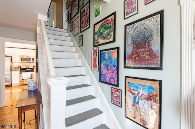 staircase featuring wood finished floors