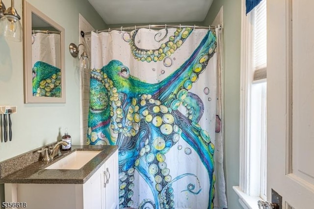 full bath with vanity and a shower with shower curtain
