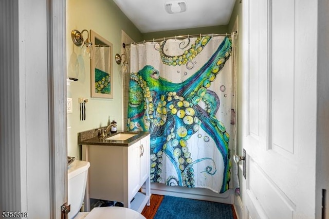 full bathroom with vanity, curtained shower, and toilet